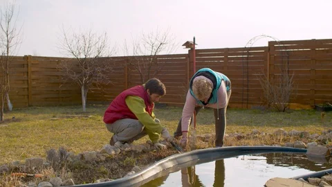 Spring weeding of flower beds Stock Footage 128792630