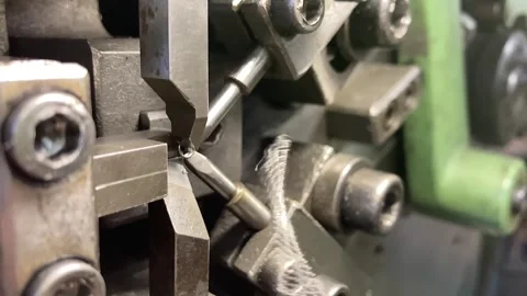 Spring winding on the machine. Manufacturing of a spring in production. Video stock 295874430