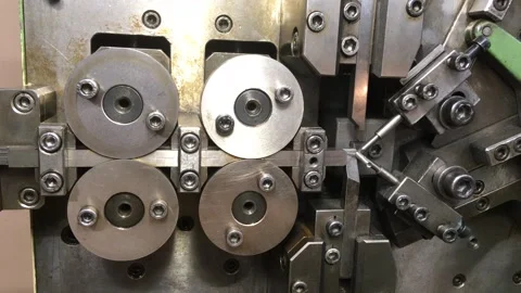 Spring winding on the machine. Manufacturing of a spring in production. Video stock 296155333
