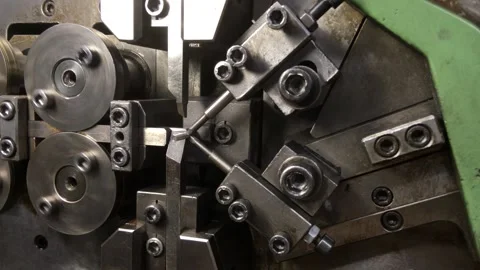 Spring winding on the machine. Manufacturing of a spring in production. Video stock 296155374