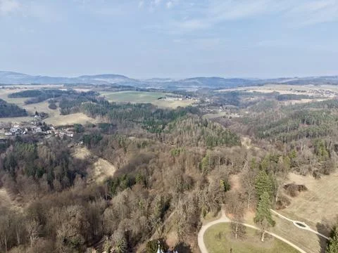 Spring woods with winding paths. Aerial perspective of dense woodland and r.. Stock Photos