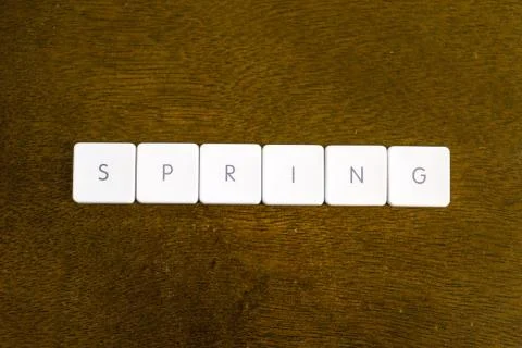 SPRING word written on plastic keyboard alphabet with dark background Stock Photos