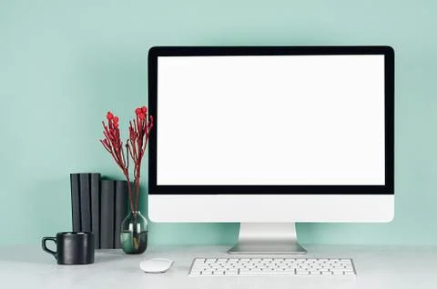 Spring workplace for work and study with blank computer display, black books, 스톡 사진