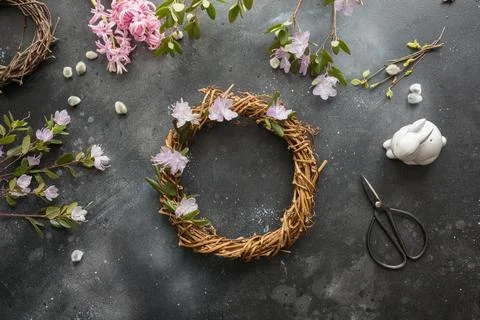 Spring wreath with flowers. Creative flat lay. View from above. Stock Photos