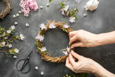 Spring wreath with flowers. Creative flat lay. View from above. Stock Photos