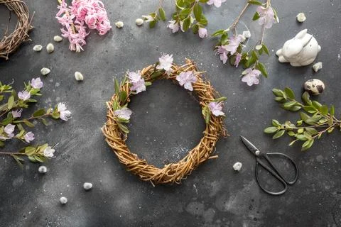 Spring wreath with flowers. Creative flat lay. View from above. Stock Photos