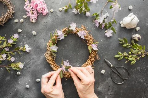 Spring wreath with flowers. Creative flat lay. View from above. Stock Photos