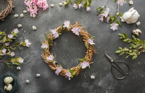 Spring wreath with flowers. Creative flat lay. View from above. Stock Photos