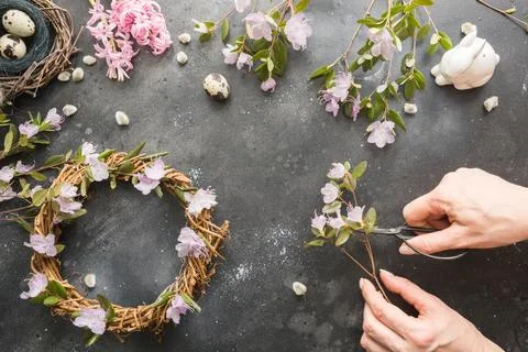 Spring wreath with flowers. Creative flat lay. View from above. Stock Photos