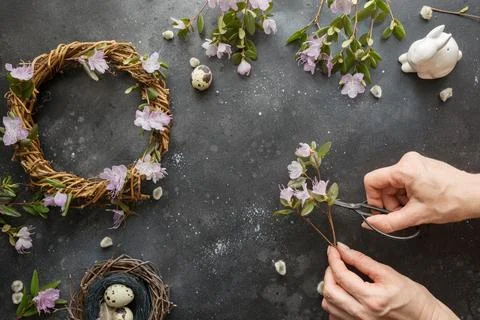 Spring wreath with flowers. Creative flat lay. View from above. Stock Photos