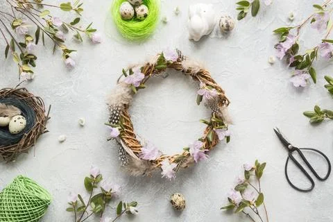 Spring wreath with flowers. Creative flat lay. View from above. Stock Photos