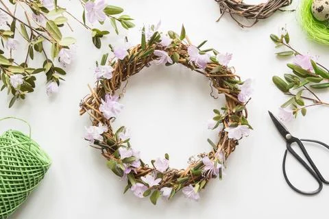 Spring wreath with flowers. Creative flat lay. View from above. Stock Photos