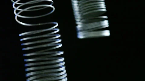 Springs motion on black background Stock Footage 37227210