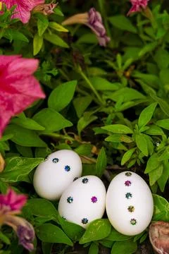 Springtime Easter Egg Arrangement with Flowers and Greenery Stock Photos