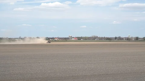Springtime farming in preparation for planting Stock Footage 129973776