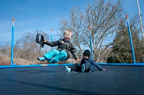 Springtime fun on a trampolin Stock Photos