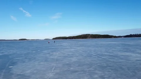 Springtime lake Saimaa ice skaters in Rauha Lappeenranta Finland Stock Footage 126090458