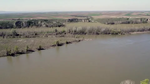 Springtime Serenity: Aerial Drone View of a River Video stock 255982276