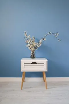 Springtime vertical composition. White spring flowers blooming branch on blue Stock Photos