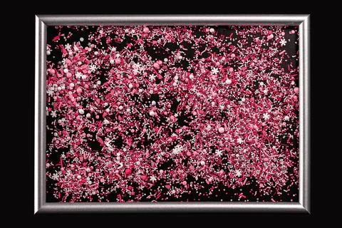 Sprinking from sweets placed in frame. Stock Photos