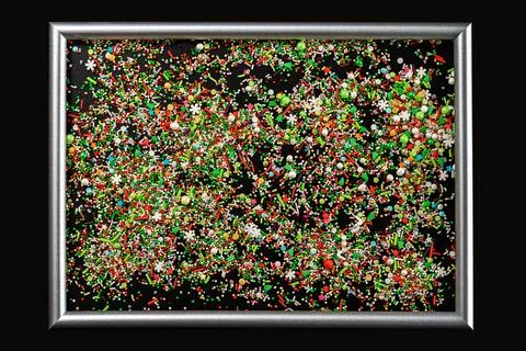 Sprinking from sweets placed in frame. Stock Photos
