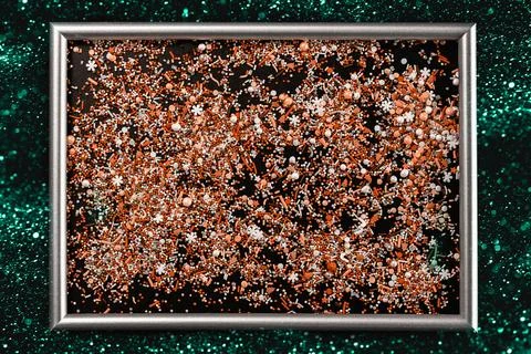 Sprinking from sweets placed in frame. Stock Photos