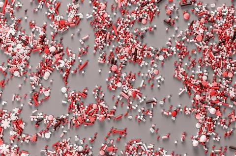 Sprinking from sweets scattered in the background. Stock Photos