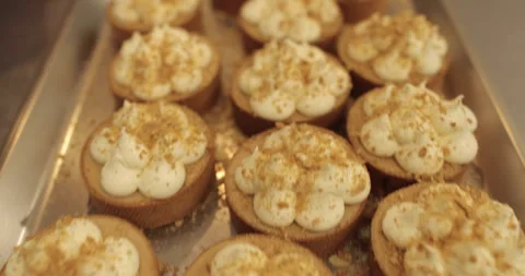 Sprinkle and decorate mini tarts with grated nuts. Stock Footage 252425853
