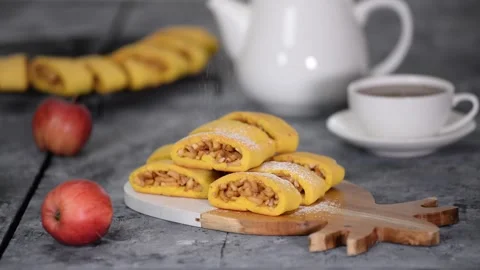 Sprinkle apple cookie with powdered sugar. Fresh homemade delicious apple Stock Footage 143569555