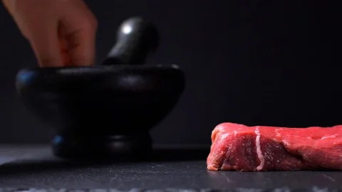 Sprinkle beef steak with salt and pepper slow motion Stock Footage 114079939