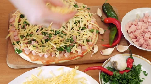 Sprinkle cheese on a pizza Stock Footage 69001722