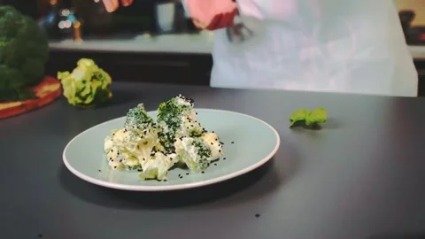 Sprinkle chia seeds on the salad Video stock 249419792