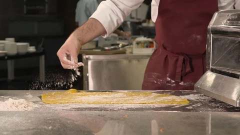 Sprinkle flour on dough Stock Footage 107891303