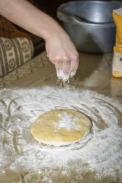 Sprinkle flour on the dough Stock Photos