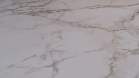 Sprinkle flour on marble surface to prepare dough Stock Footage 204918730