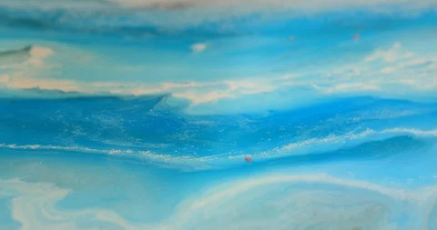 Sprinkle fractions of burgundy stones, ruby gem on blue background Stock Footage 129078498