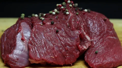 Sprinkle fresh beef with spices. Stock Footage 128285129