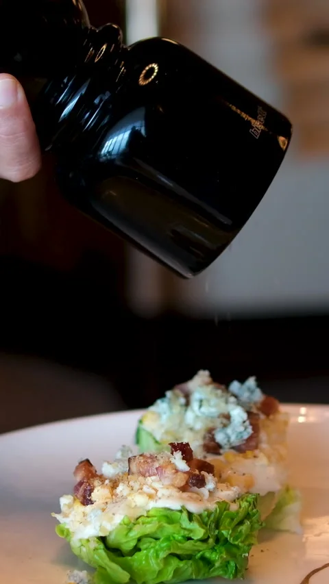 Sprinkle with ground black pepper WEDGE SALAD smoked bacon, hard boiled egg Stock-Footage 292184007
