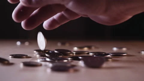 Sprinkle a handful of coins on the table Stock Footage 152416181