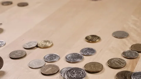 Sprinkle a handful of coins on the table 스톡 동영상 152416647