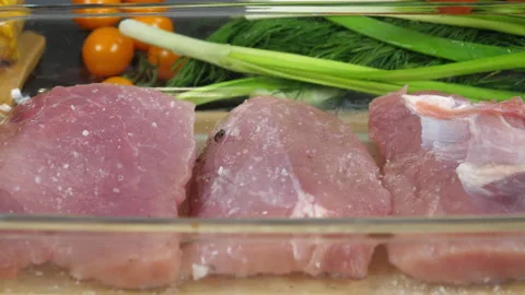 Sprinkle the meat with salt before frying Stock-Footage 170603379