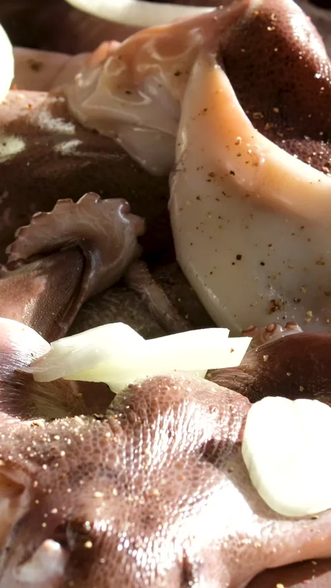 Sprinkle octopus with onions Rotating Loop spin top view Mama noodle salad with Video stock 302737140
