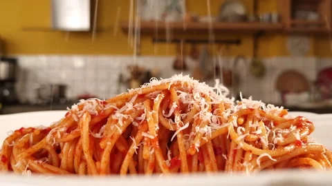 Sprinkle parmesan cheese on spagetti, close up Stock Footage 205410428