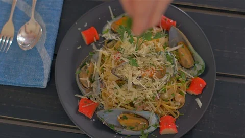 Sprinkle with parsley. Seafood paste and mussels Stock Footage 111670830