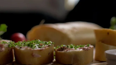 Sprinkle with pepper on slices of pate. Slow motion Stock-Footage 105878667