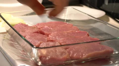 Sprinkle pork on a dish with spices 스톡 동영상 143109682