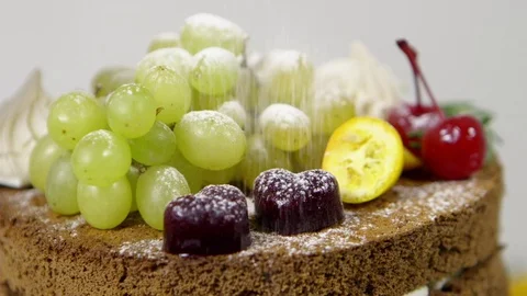 Sprinkle powder sugar on tasty cake Stock Footage 70964937
