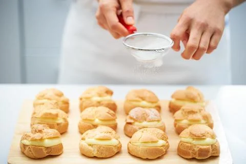 Sprinkle powdered sugar on bread Stock Photos