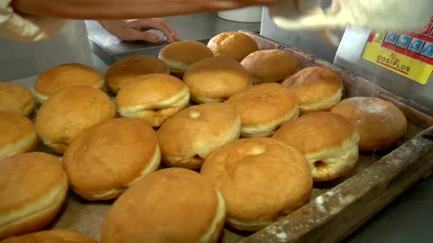 Sprinkle with powdered sugar donuts Stock Footage 99614377