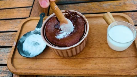 Sprinkle powdered sugar over a souffle filled with melted chocolate and eat it Видео 332555591
